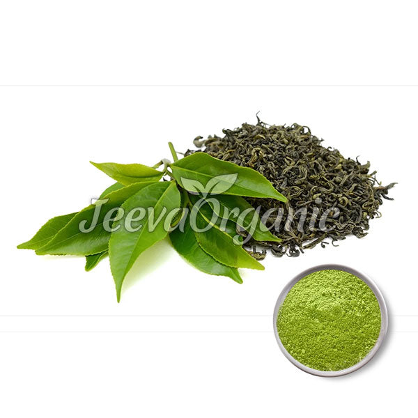 A cluster of green tea leaves beside dried green tea leaves and a bowl of bright green tea powder, showcasing organic products.