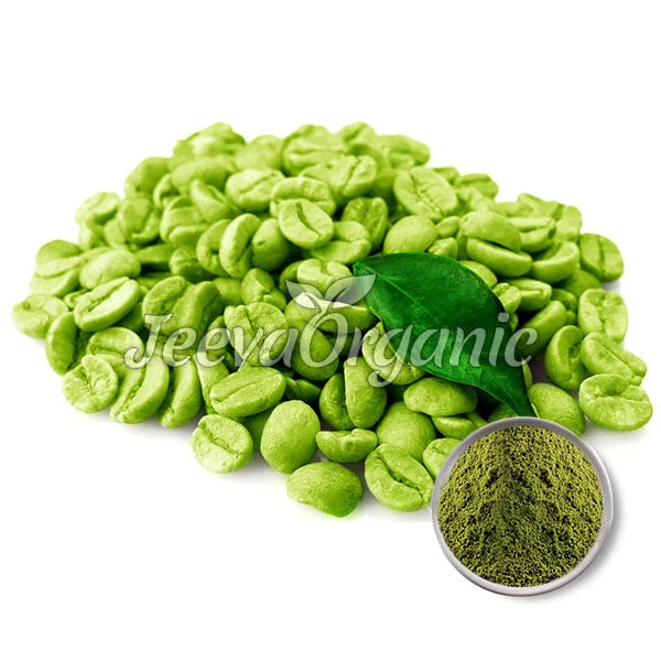 A pile of vibrant green coffee beans with a fresh leaf, accompanied by a small bowl of finely ground green coffee powder.