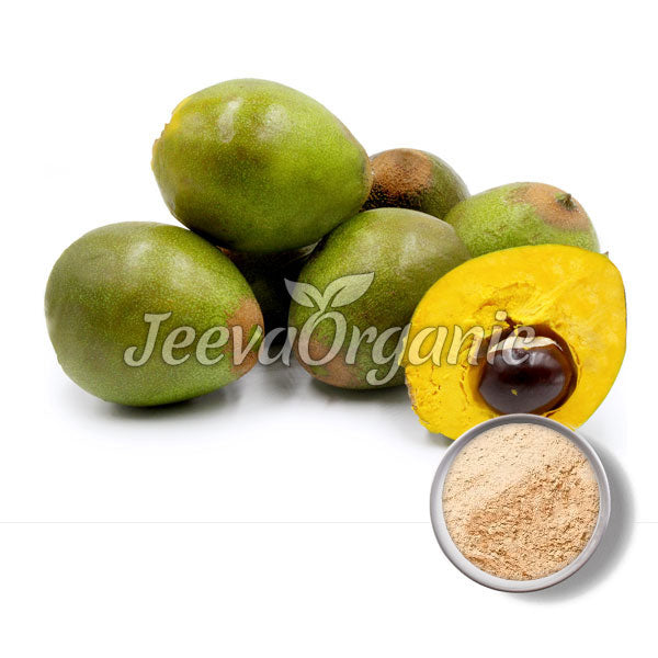 Five green sapodilla fruits with one cut open to reveal its yellow flesh and seed, accompanied by a bowl of sapodilla powder.