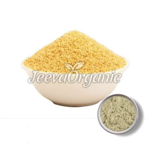 A white bowl filled with yellow semolina, with a smaller bowl of green powder beside it, labeled "Jeeva Organic."