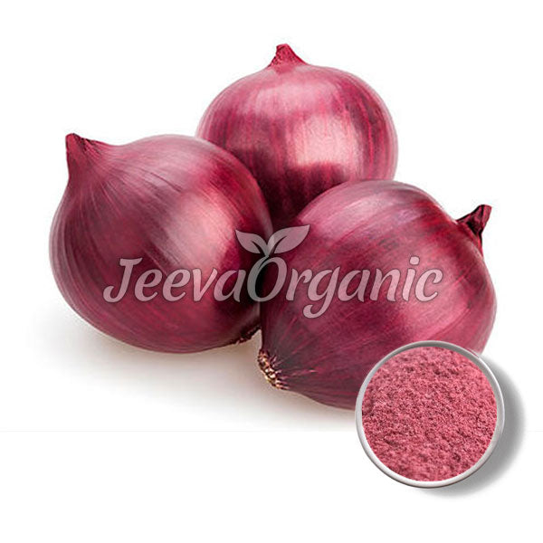 Three red onions arranged in a cluster, alongside a small bowl of reddish-purple onion powder.