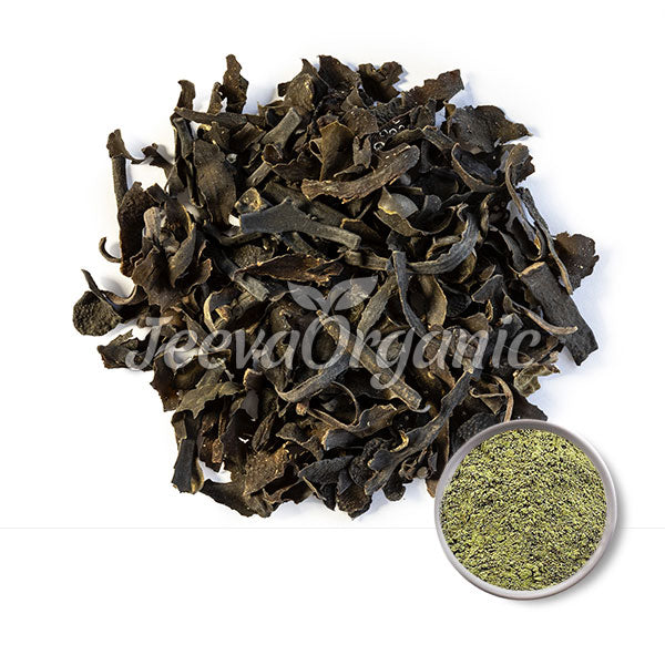 Dried black seaweed flakes surrounded by a green powdered variant, both labeled as organic products by Jeeva Organic.
