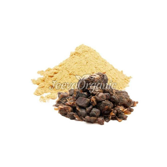 A container of organic guggul extract powder, a light brown to tan fine powder derived from the resin of the Commiphora mukul tree, used in Ayurvedic medicine and supplements.